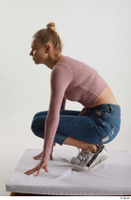  Kate Jones  1 blue jeans casual dressed kneeling pink long sleeve t shirt white sneakers whole body 0003.jpg